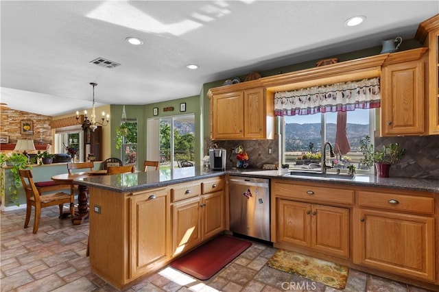 23220 Lakeview Dr, Tehachapi, CA 93561 - kitchen featuring stainless steel dishwasher, tasteful backsplash, a peninsula, light stone finish floors, and recessed lighting