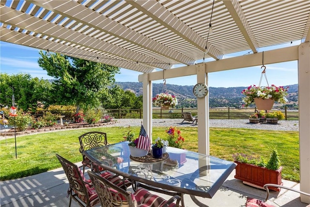 23220 Lakeview Dr, Tehachapi, CA 93561 - fenced backyard with a mountain view, outdoor dining space, a patio, and a pergola