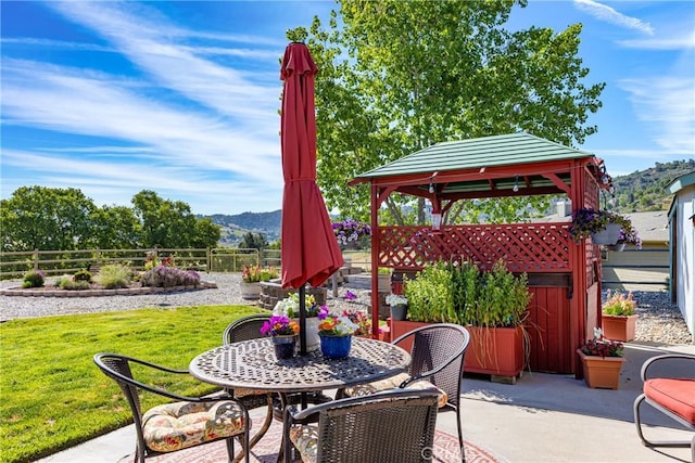 23220 Lakeview Dr, Tehachapi, CA 93561 - fenced backyard featuring a gazebo, a mountain view, a patio area, and outdoor dining space