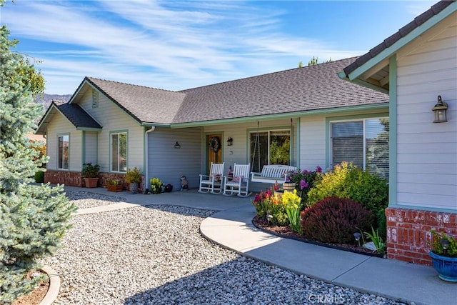 23220 Lakeview Dr, Tehachapi, CA 93561 - view of front of property with covered porch and a shingled roof