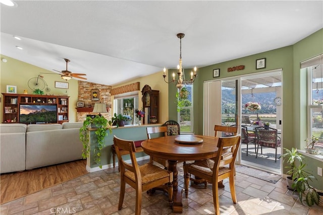 23220 Lakeview Dr, Tehachapi, CA 93561 - dining room with stone tile floors, healthy amount of natural light, a chandelier, a ceiling fan, and lofted ceiling
