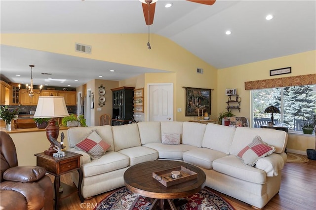 23220 Lakeview Dr, Tehachapi, CA 93561 - living area featuring wood finished floors, high vaulted ceiling, a ceiling fan, recessed lighting, and a chandelier
