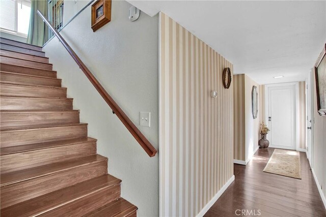15037 Wildflower Ln, Helendale, CA 92342 - stairs featuring wood finished floors and baseboards