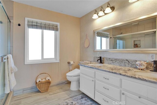 15037 Wildflower Ln, Helendale, CA 92342 - full bath featuring a shower stall, wood finished floors, and double vanity