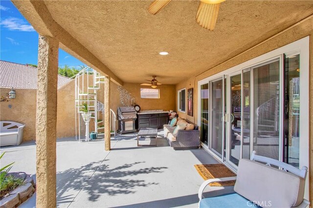 15037 Wildflower Ln, Helendale, CA 92342 - view of patio featuring ceiling fan, grilling area, and stairway