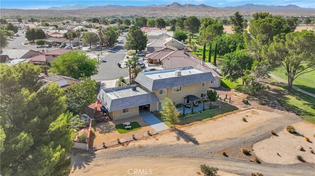 15037 Wildflower Ln, Helendale, CA 92342 - aerial perspective of suburban area with a mountainous background