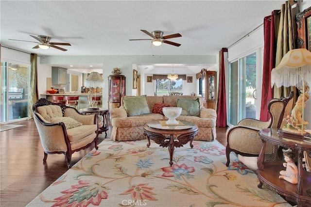 15037 Wildflower Ln, Helendale, CA 92342 - living area featuring ceiling fan, healthy amount of natural light, and wood finished floors