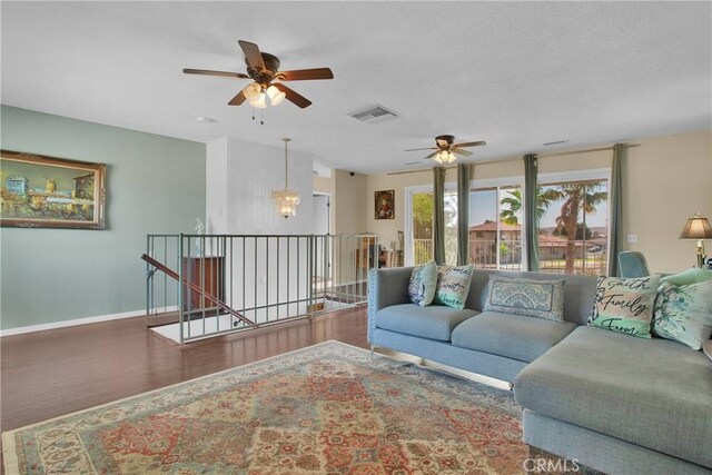 15037 Wildflower Ln, Helendale, CA 92342 - living area featuring a ceiling fan, wood finished floors, and a chandelier