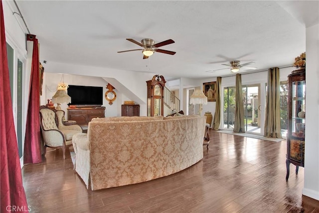 15037 Wildflower Ln, Helendale, CA 92342 - living area with a ceiling fan, dark wood-style flooring, and stairway