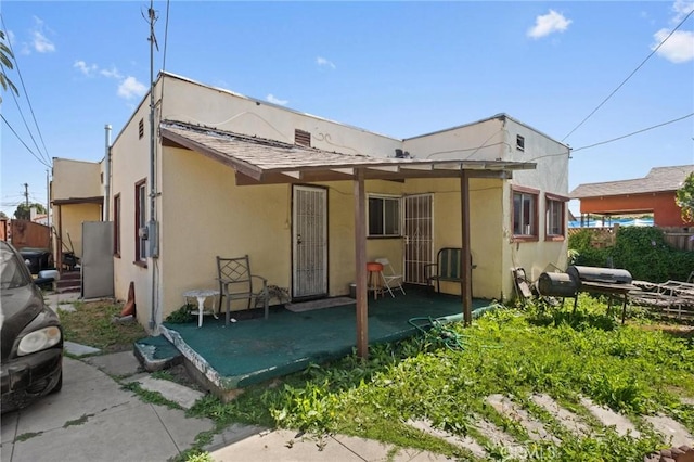 1636 W 70th St, Los Angeles, CA 90047 - rear view of house with stucco siding