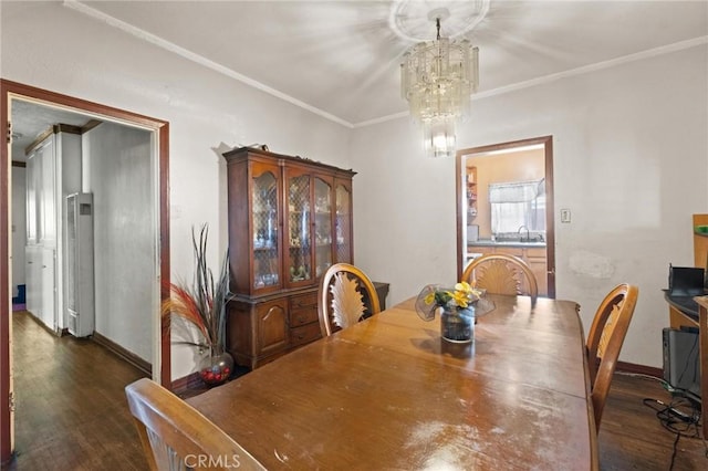1636 W 70th St, Los Angeles, CA 90047 - dining room with a chandelier, dark wood finished floors, a heating unit, and ornamental molding