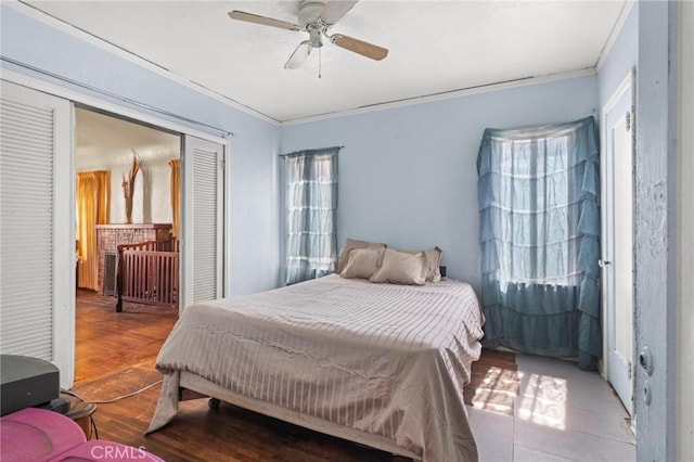 1636 W 70th St, Los Angeles, CA 90047 - bedroom with ornamental molding, a closet, wood finished floors, and ceiling fan
