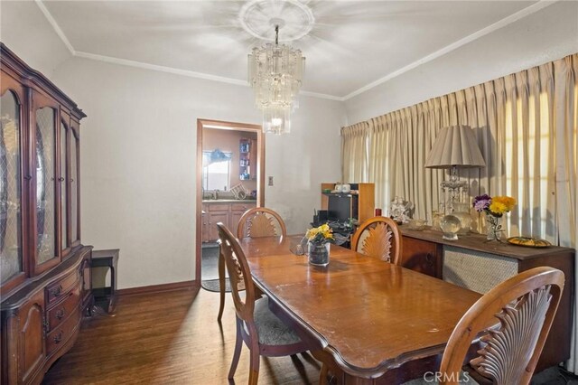 1636 W 70th St, Los Angeles, CA 90047 - dining room featuring a chandelier, wood finished floors, and crown molding