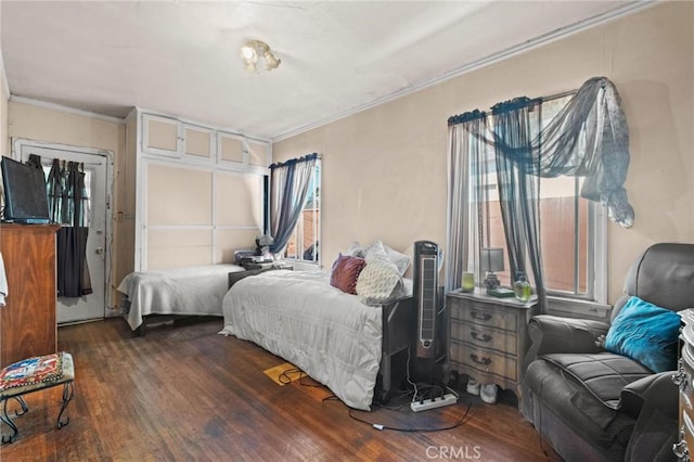 1636 W 70th St, Los Angeles, CA 90047 - bedroom featuring wood finished floors, multiple windows, and crown molding