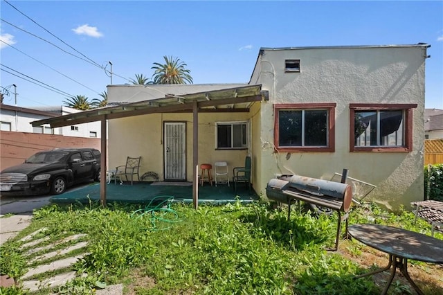 1636 W 70th St, Los Angeles, CA 90047 - back of house with stucco siding