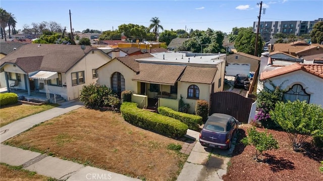1636 W 70th St, Los Angeles, CA 90047 - view of front facade with a gate and stucco siding
