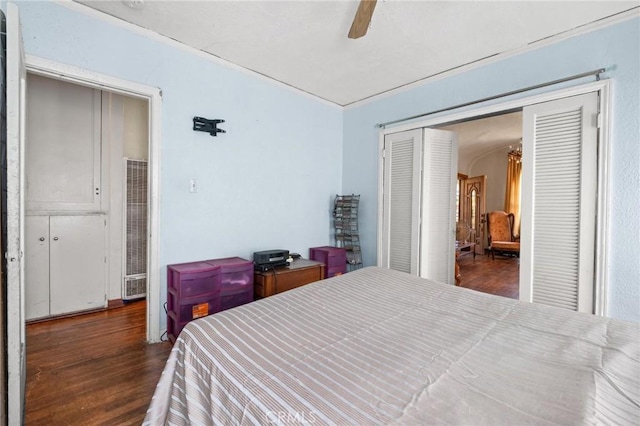 1636 W 70th St, Los Angeles, CA 90047 - bedroom featuring a heating unit, wood finished floors, a closet, and ceiling fan