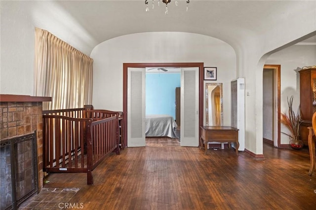 1636 W 70th St, Los Angeles, CA 90047 - hall featuring hardwood / wood-style flooring, arched walkways, a heating unit, a chandelier, and lofted ceiling