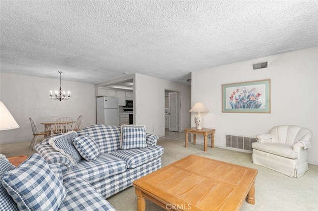 5081 Blackpool Rd, Westminster, CA 92683 - living room with a chandelier, light carpet, and a textured ceiling