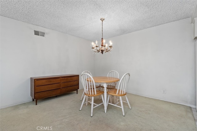5081 Blackpool Rd, Westminster, CA 92683 - dining area featuring a chandelier, carpet flooring, and a textured ceiling