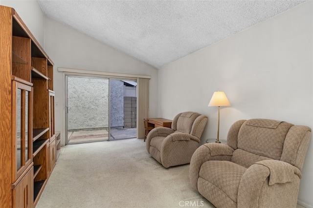 5081 Blackpool Rd, Westminster, CA 92683 - living area with carpet floors, a textured ceiling, and vaulted ceiling