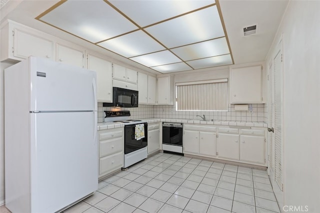 5081 Blackpool Rd, Westminster, CA 92683 - kitchen featuring white appliances, tile counters, white cabinets, and backsplash