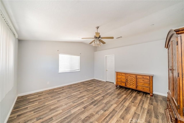 8225 Ailanthus St, Phelan, CA 92371 - unfurnished room with wood finished floors, ceiling fan, and lofted ceiling