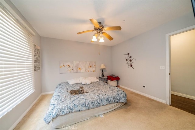 8225 Ailanthus St, Phelan, CA 92371 - bedroom with light colored carpet and a ceiling fan