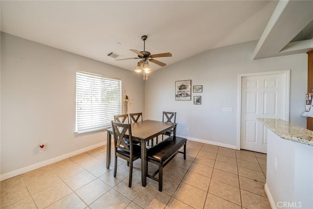 8225 Ailanthus St, Phelan, CA 92371 - dining area featuring a ceiling fan, vaulted ceiling, and light tile patterned floors