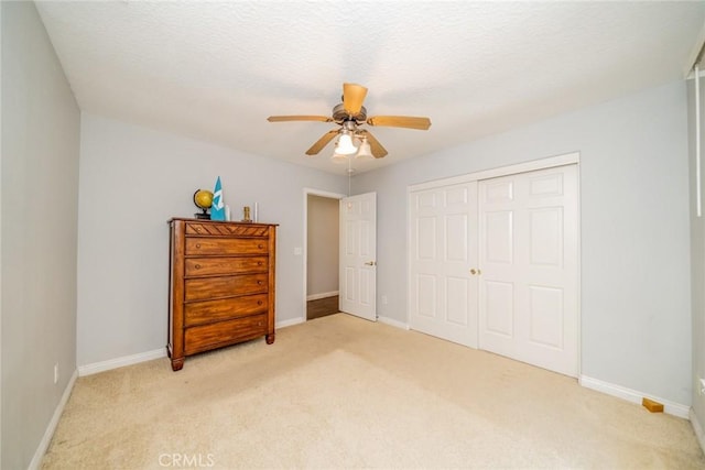 8225 Ailanthus St, Phelan, CA 92371 - bedroom with light colored carpet, a closet, and ceiling fan