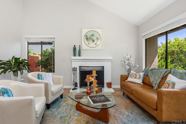 247 Currant Way, Oceanside, CA 92057 - living room featuring wood finished floors, a brick fireplace, and high vaulted ceiling