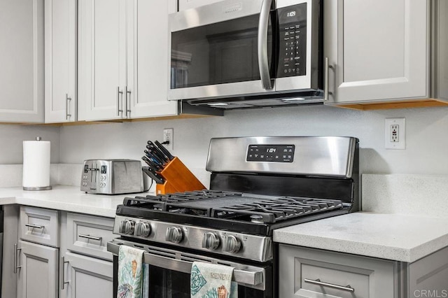 247 Currant Way, Oceanside, CA 92057 - kitchen featuring stainless steel appliances, gray cabinets, and light stone counters