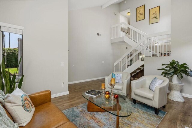 247 Currant Way, Oceanside, CA 92057 - living room featuring stairway, wood finished floors, and high vaulted ceiling
