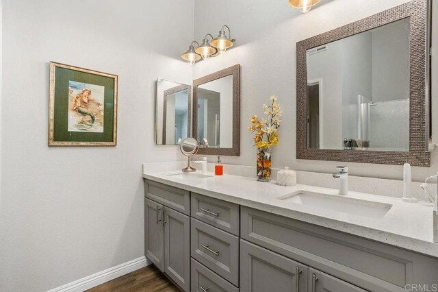 247 Currant Way, Oceanside, CA 92057 - bathroom with double vanity and wood finished floors