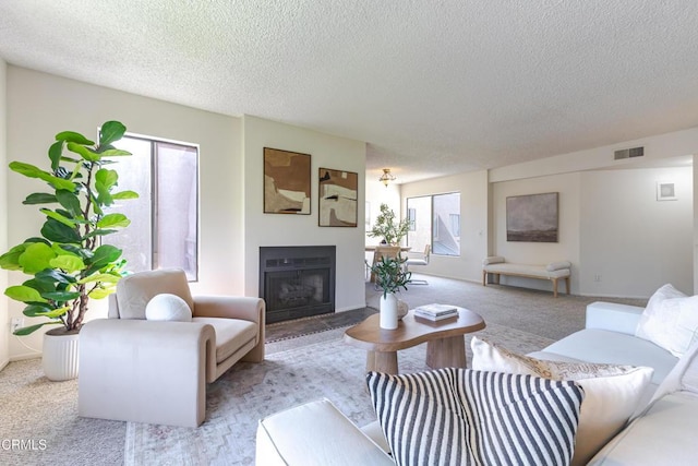 1125 E Maple St Unit 6, Glendale, CA 91205 - carpeted living area featuring a textured ceiling and a glass covered fireplace