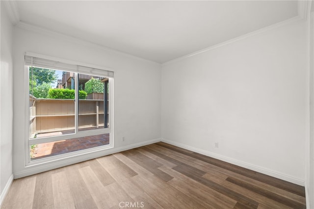 1001 W Stevens Ave Unit 184, Santa Ana, CA 92707 - empty room featuring wood finished floors and crown molding