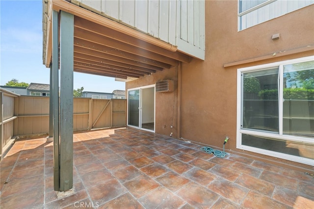 1001 W Stevens Ave Unit 184, Santa Ana, CA 92707 - view of patio / terrace featuring a gate and a wall mounted air conditioner