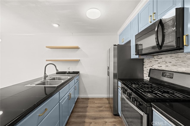 1001 W Stevens Ave Unit 184, Santa Ana, CA 92707 - kitchen featuring stainless steel gas range oven, black microwave, blue cabinetry, dark countertops, and ornamental molding