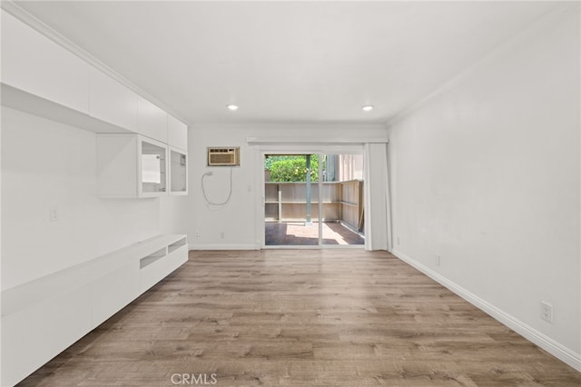 1001 W Stevens Ave Unit 184, Santa Ana, CA 92707 - unfurnished room with ornamental molding, a wall unit AC, light wood-type flooring, and recessed lighting