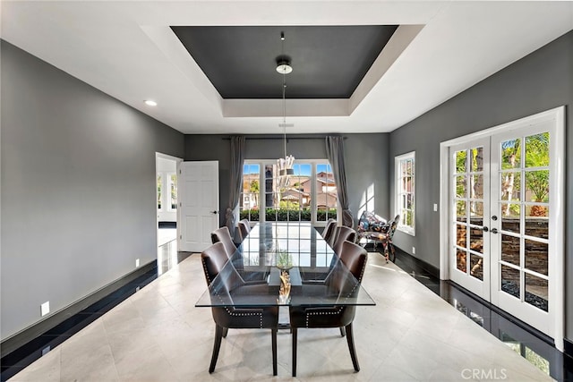 30372 Marbella Vis, San Juan Capistrano, CA 92675 - dining room featuring french doors, a tray ceiling, a chandelier, and recessed lighting