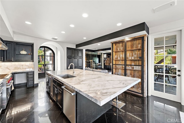 30372 Marbella Vis, San Juan Capistrano, CA 92675 - kitchen with granite floors, arched walkways, dishwasher, recessed lighting, and a large island