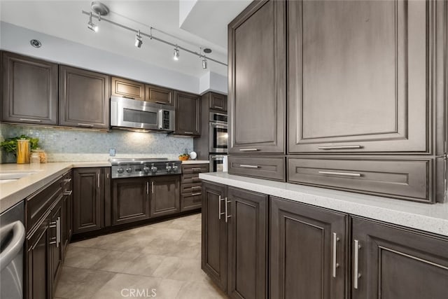 222 Monterey Rd Unit 1203, Glendale, CA 91206 - kitchen with stainless steel appliances, dark brown cabinetry, tasteful backsplash, and light stone countertops