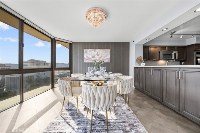 222 Monterey Rd Unit 1203, Glendale, CA 91206 - dining space with wallpapered walls, recessed lighting, light tile patterned floors, expansive windows, and an accent wall
