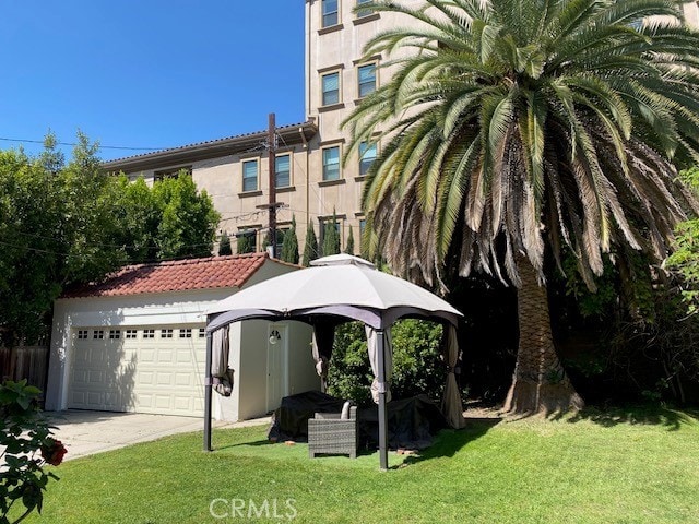 667 S Bronson, Los Angeles, CA 90005 - exterior space featuring a garage and driveway