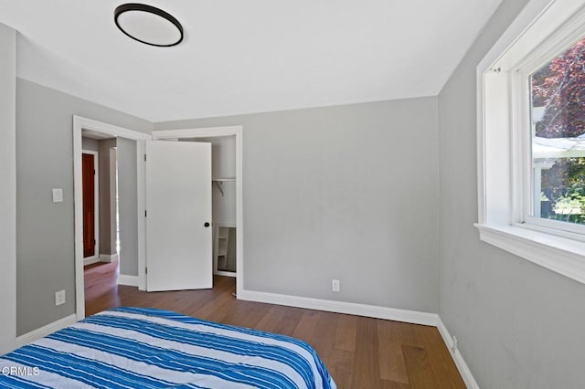 7950 Flynn Creek Rd, Comptche, CA 95427 - unfurnished bedroom featuring wood finished floors and a closet
