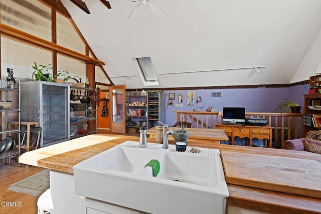 7950 Flynn Creek Rd, Comptche, CA 95427 - kitchen featuring vaulted ceiling, wood finished floors, and ceiling fan