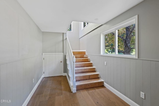 7950 Flynn Creek Rd, Comptche, CA 95427 - staircase with hardwood / wood-style flooring and wainscoting