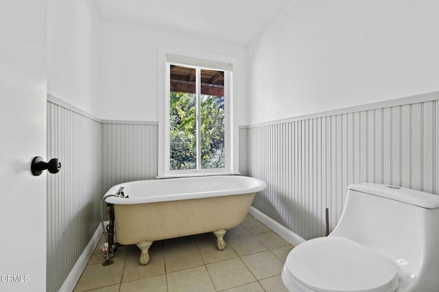 7950 Flynn Creek Rd, Comptche, CA 95427 - bathroom featuring a soaking tub, tile patterned floors, and a wainscoted wall