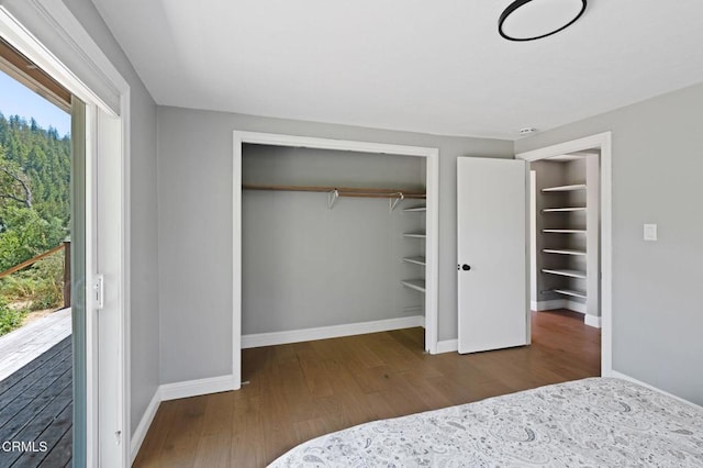 7950 Flynn Creek Rd, Comptche, CA 95427 - unfurnished bedroom featuring wood finished floors and a closet