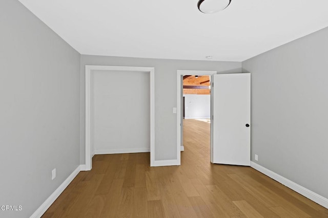 7950 Flynn Creek Rd, Comptche, CA 95427 - unfurnished bedroom featuring wood finished floors and baseboards